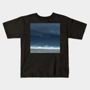 Stormy skies and playful dolphins Kids T-Shirt